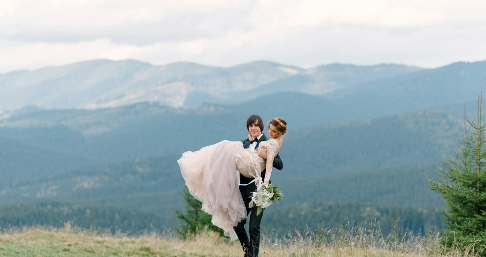 Running couple enjoying honeymoon adventure