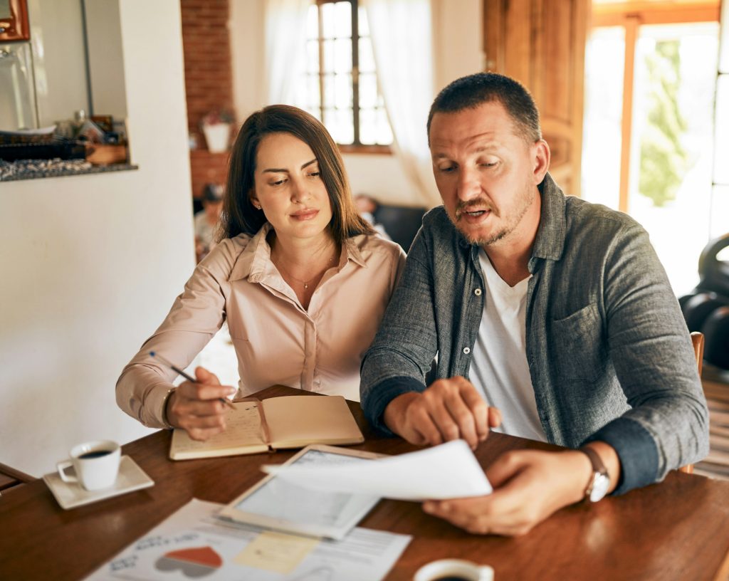 Family planning together. Cropped shot of a married couple planning their financial budget at home.